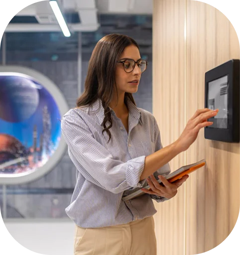 Woman interacting with smart wall panel